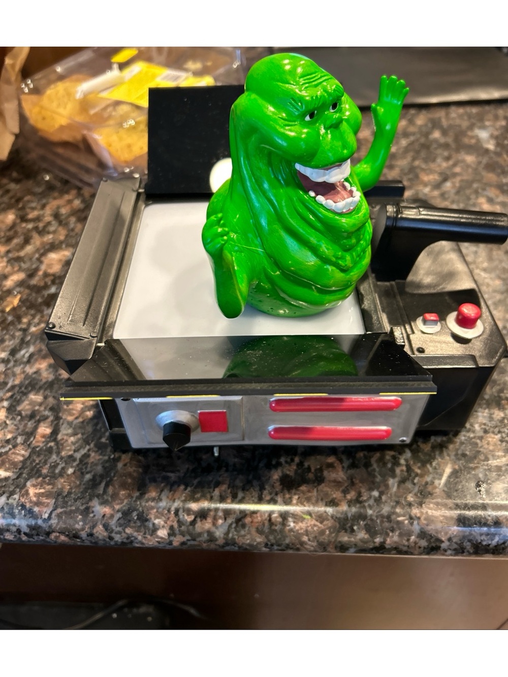 Green Slimer Ghostbuster Figure in Black Ghost Trap Display